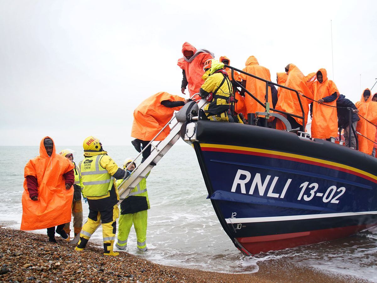 A group of people thought to be migrants are brought in following a small boat incident in the Channel