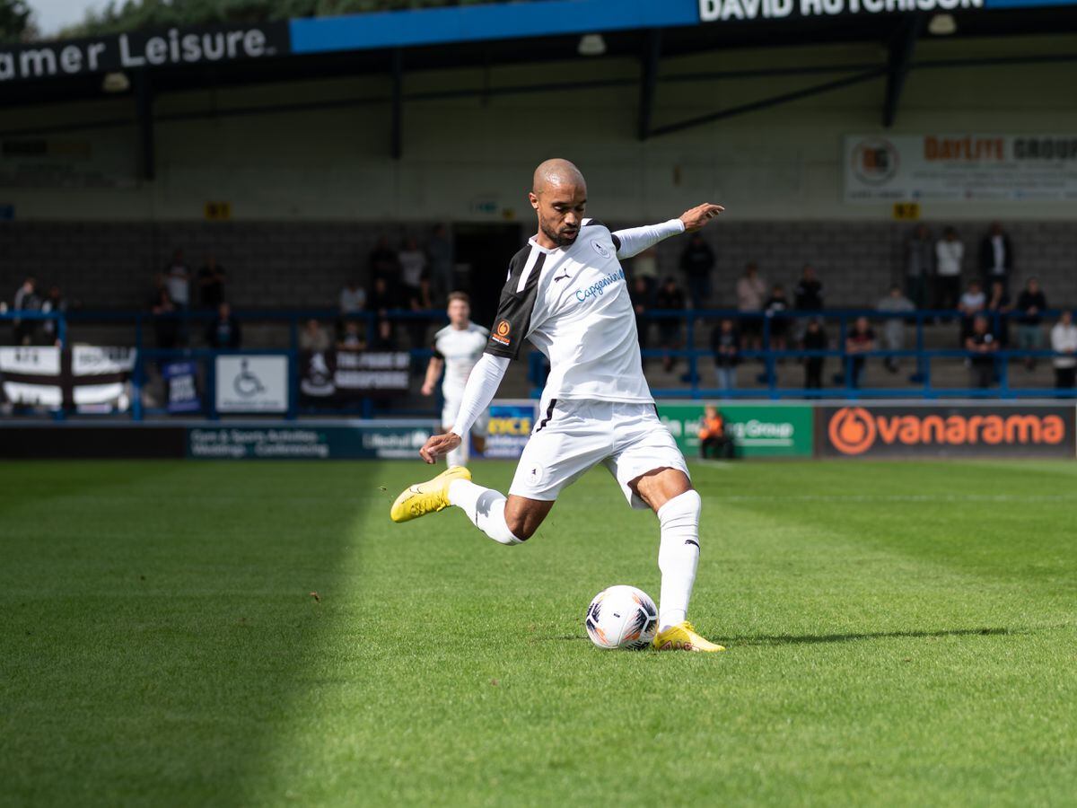 Byron Moore (11) (AFC Telford United Midfielder) about to put a cross into the box.