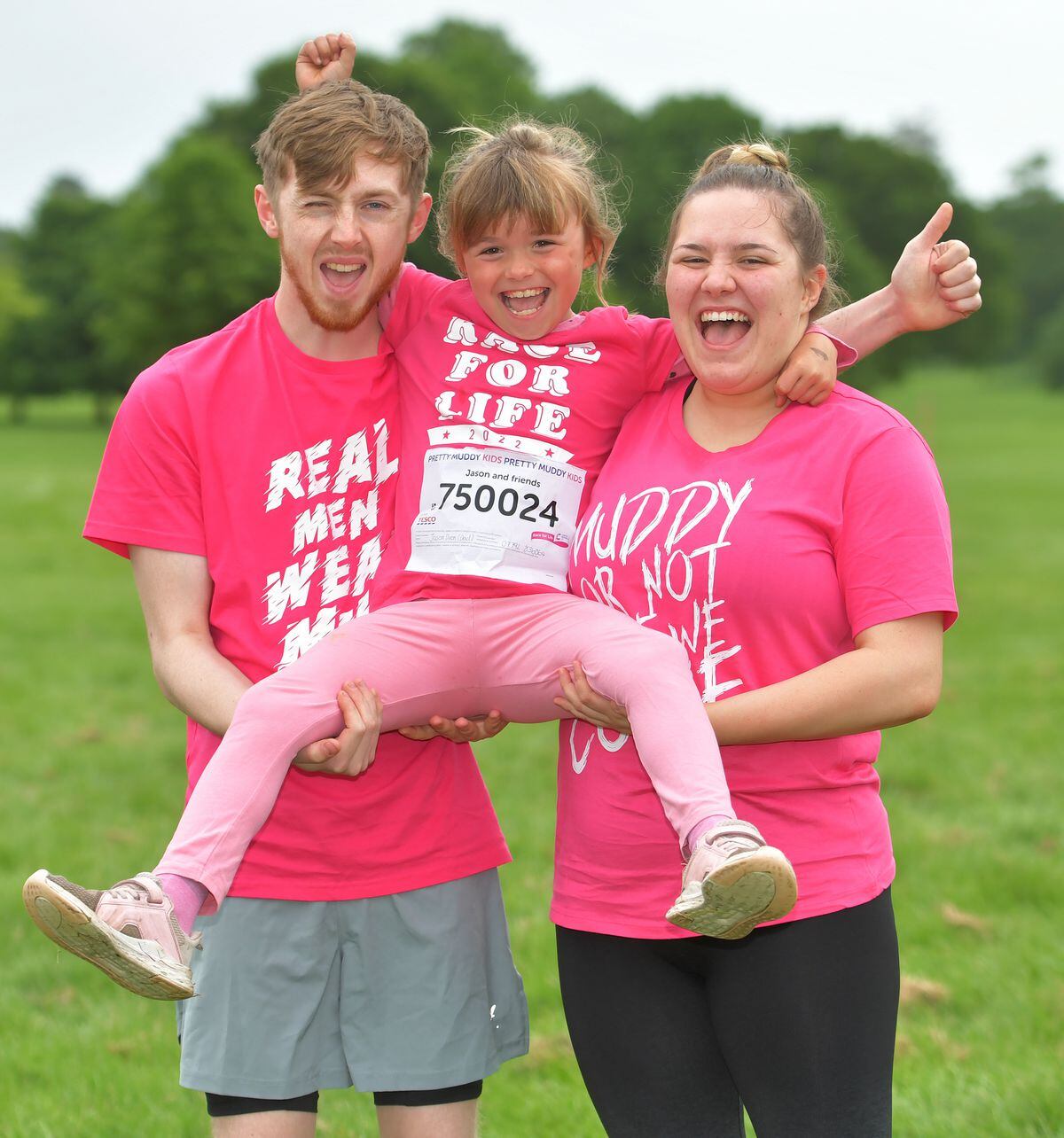 Harry Clews and Kayla Dixon with Kayla's sister Sky, 8, at the Pretty Muddy event at Weston Park.