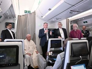 The Archbishop of Canterbury Justin Welby, right, Pope Francis, left, and the Moderator of the General Assembly of the Church of Scotland the Rt Rev Iain Greenshields meet journalists during an airborne press conference aboard the plane directed to Rome, at the end of his pastoral visit to Congo and South Sudan