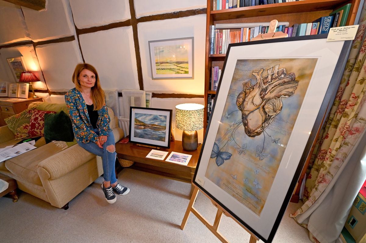 Artist Delny Fitrzyk with some of her work on display