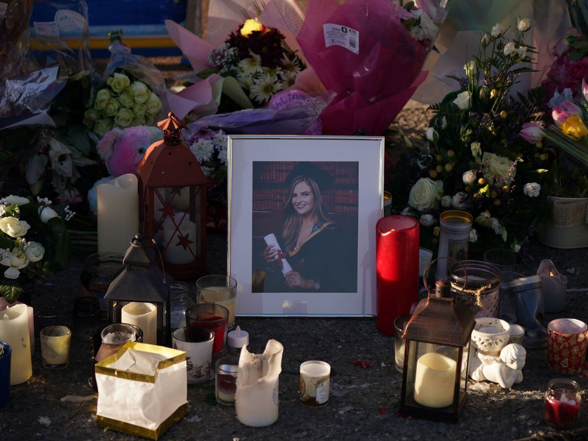 Floral tributes and candles surround a photographer left at the Grand Canal in Tullamore, Co Offaly, where primary school teacher Ashling Murphy was found dead after going for a run on Wednesday afternoon (Niall Carson/PA)