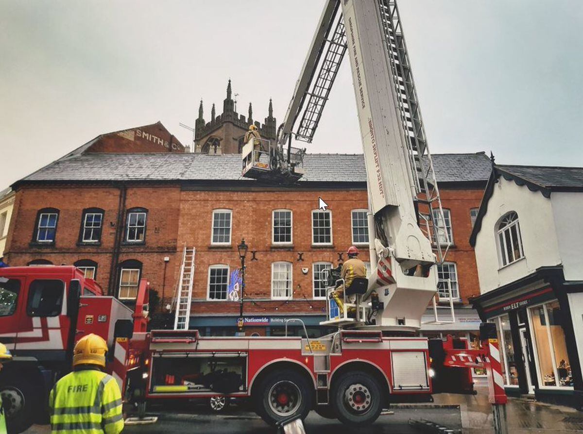 Fire crews used an aerial ladder platform to remove the tile safely