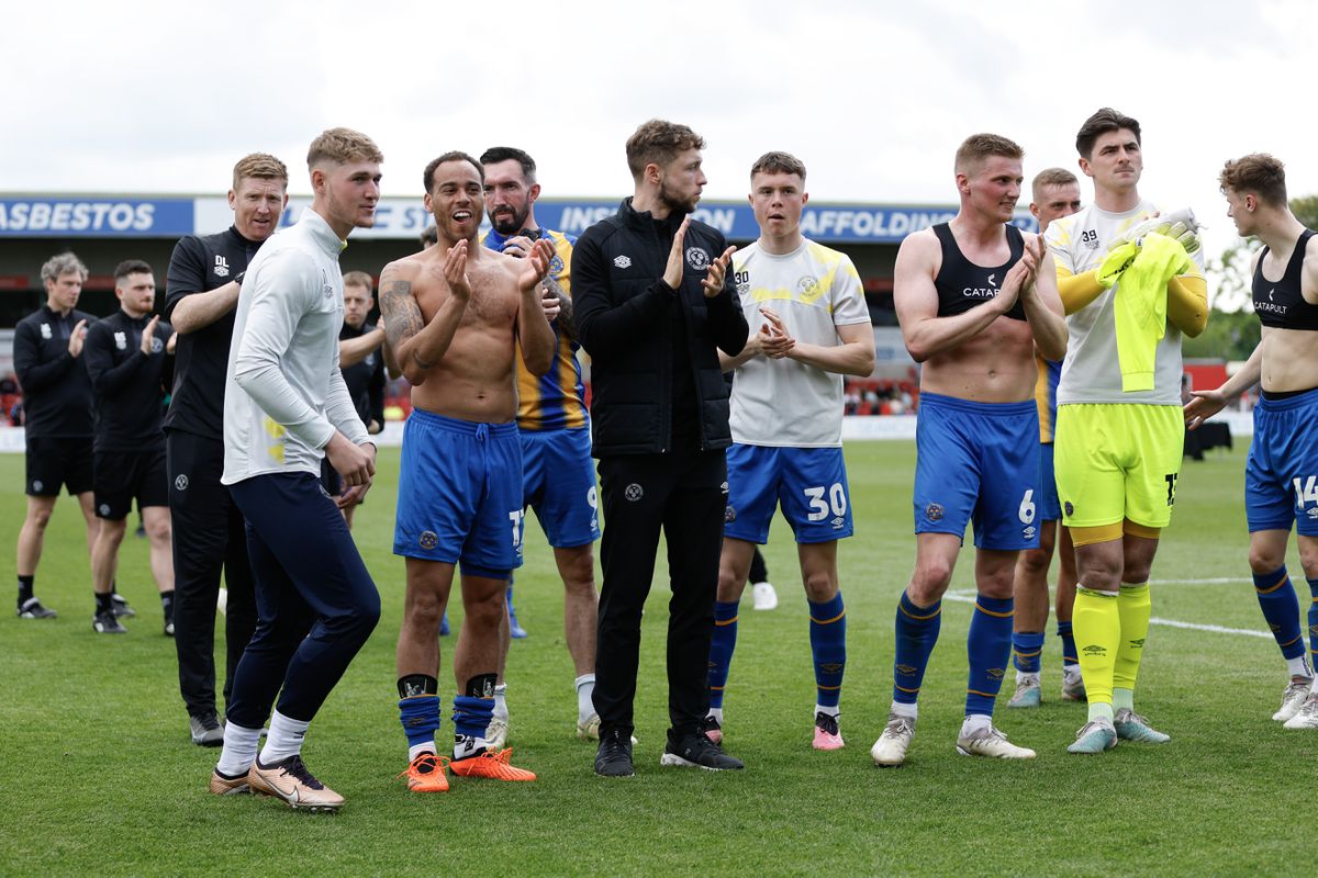 Shrewsbury Town players applaud the fans at full time at Lincoln (AMA)