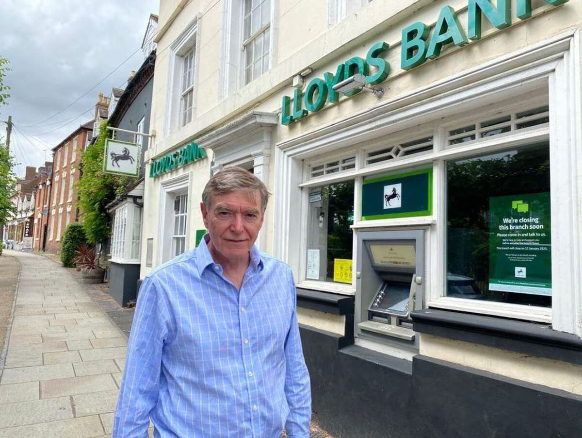 Philip Dunne MP ouside the bank