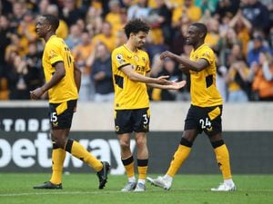 Rayan Ait-Nouri celebrates with Toti Gomes after scoring against Norwich City