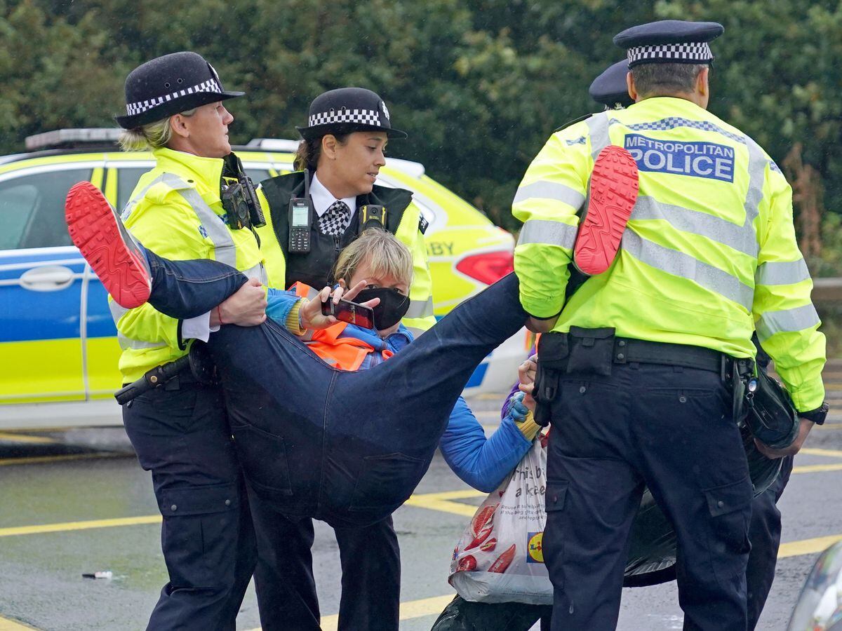 Insulate Britain protester is led away