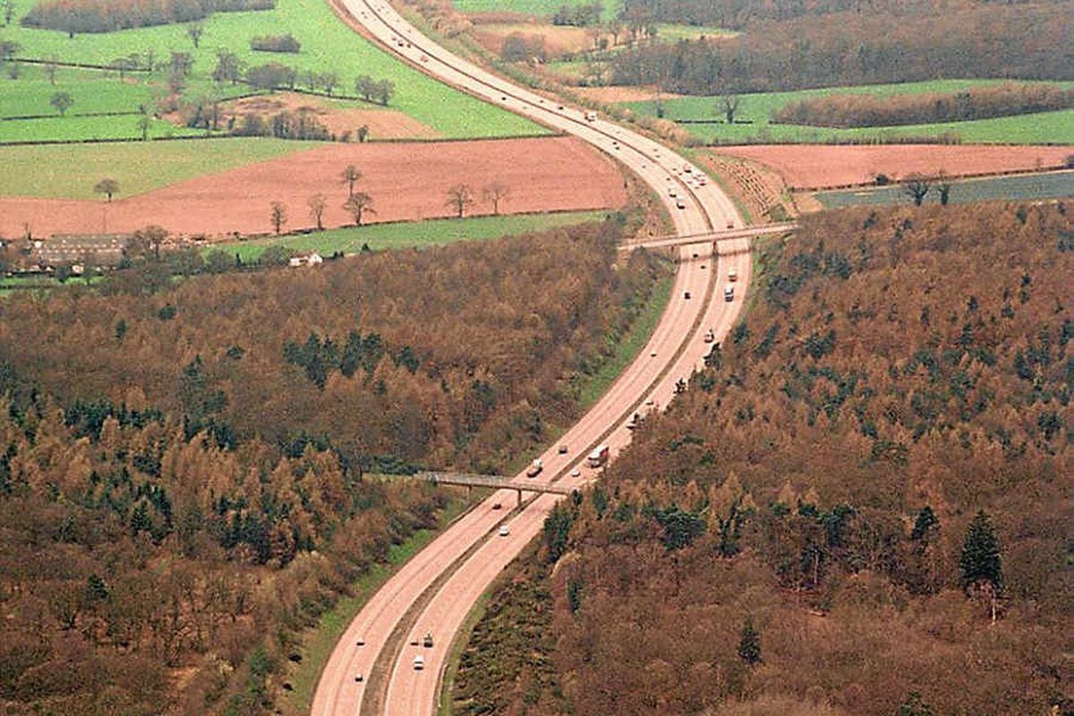 In contrast to the largely straight A5, the M54 snakes across the countryside. This is a 1997 view east of Junction Three, looking west.