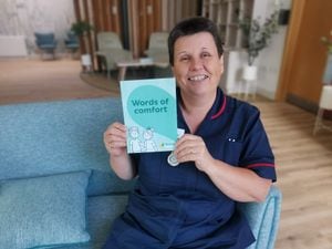 Mandy Reynolds, Ward Manager at Severn Hospice in Apley, wit the booklet in the communal area on the ward.