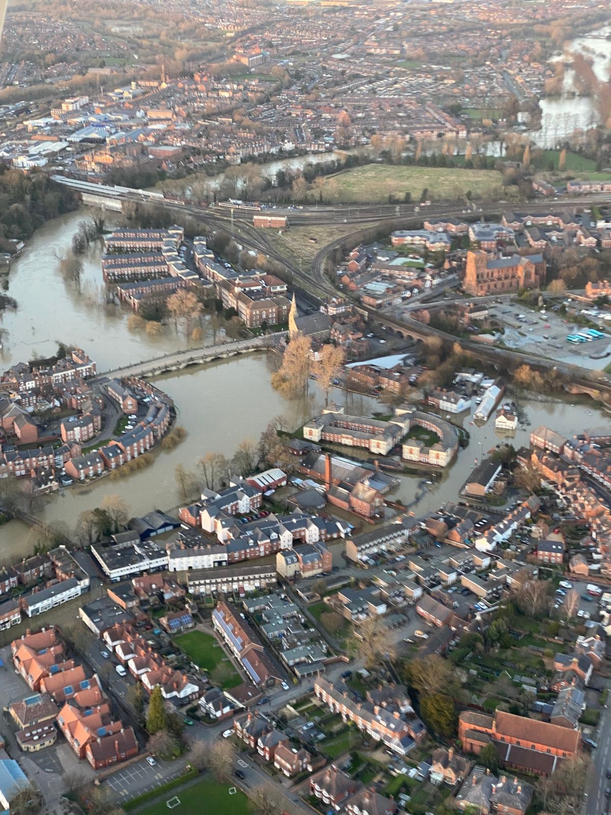 Shrewsbury's February 2022 flooding viewed from the air, showing water reaching Abbey Foregate car park. Photo: Bruce Buglass
