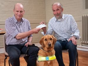At a recent Guide Dogs event at the Mascall Centre, Ludlow, event organiser Mike Morris, left, presented the donation to Merredith Vivian and his guide dog Gerry.