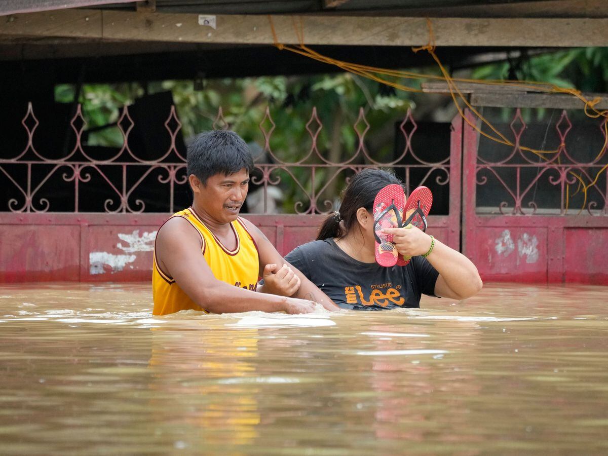 People on a flooded road