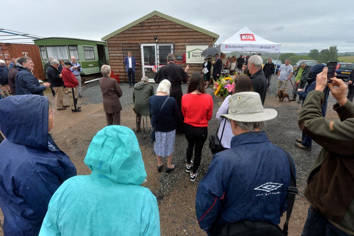 People gather for the opening of the Mens Shed