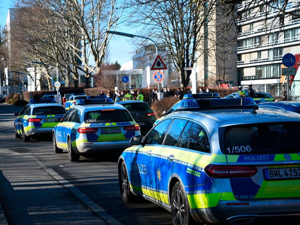 Police vehicles on the grounds of Heidelberg University in Heidelberg, Germany
