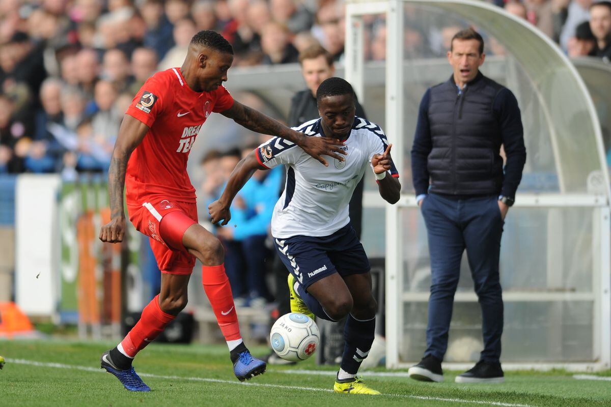 Dan Udoh of AFC Telford takes on Marvin Ekpiteta of Orient during the FA Trophy Semi Final fixture between AFC Telford United and Leyton Orient at the New Bucks Head