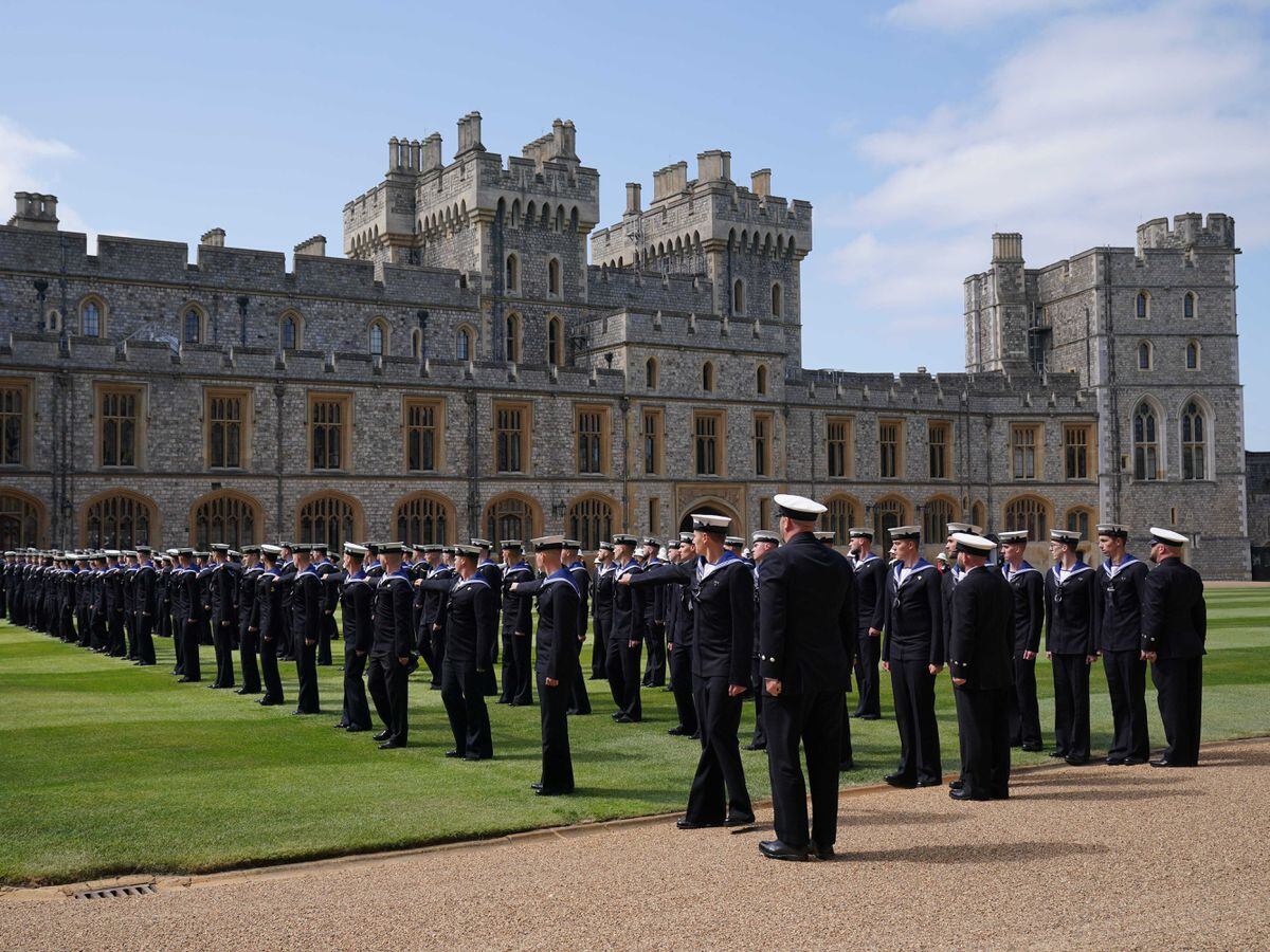 Members of the Royal Navy before being presented with their Royal Victorian Order medals by the King for their part in Queen Elizabeth II’s funeral procession, on the Quadrangle at Windsor Castle