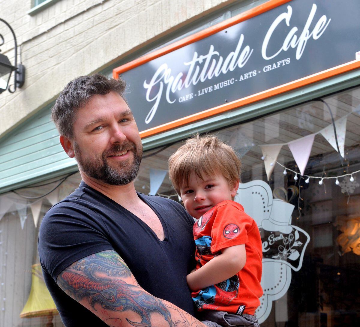 Dave Busby, one of the owners of the Gratitude Cafe, with his son Solomon