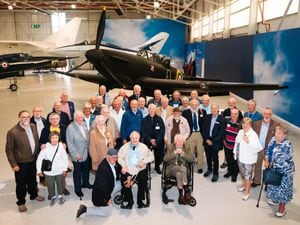 Former workers in front of the Boulton Paul Defiant aircraft at RAF Cosford