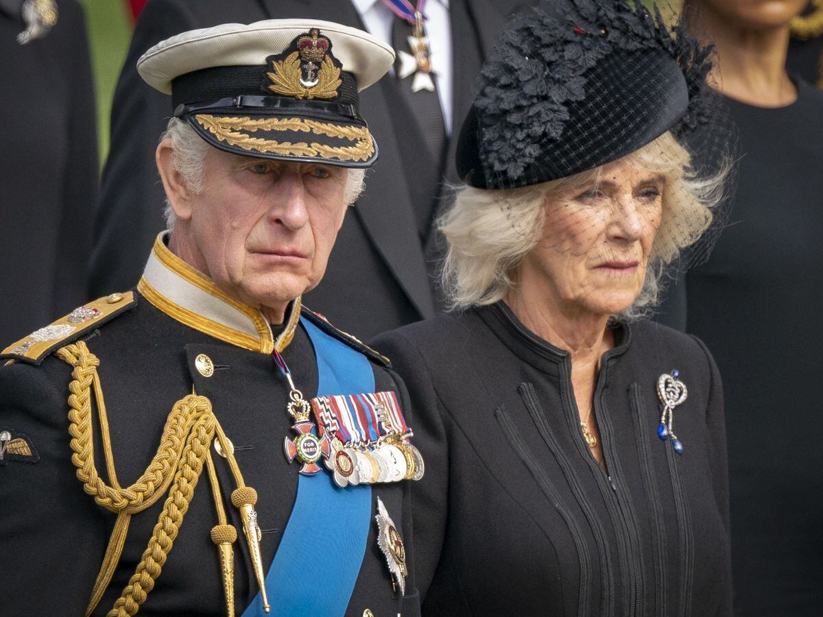King Charles III and the Queen Consort look on at the funeral for the Queen