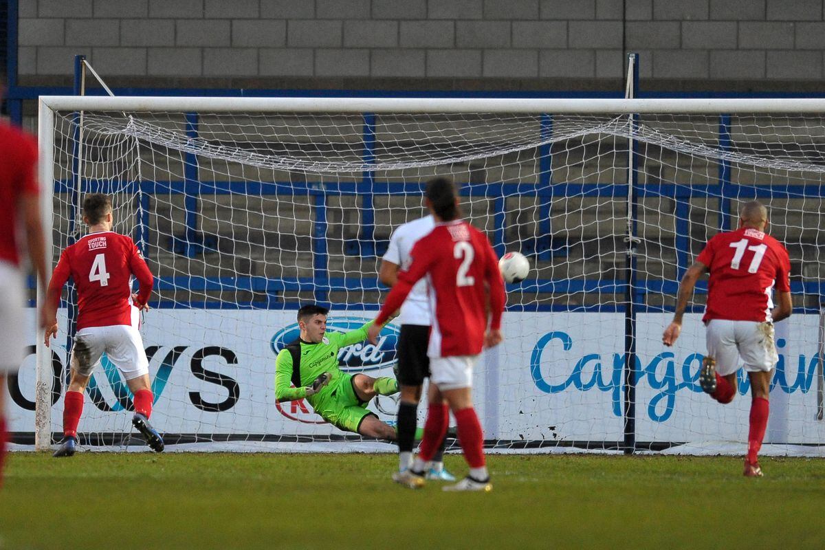 Matt Yates of Telford (on loan from Derby County) saves a penalty from Shane Byrne of Brackley (Picture credit: Mike Sheridan/Ultrapress)