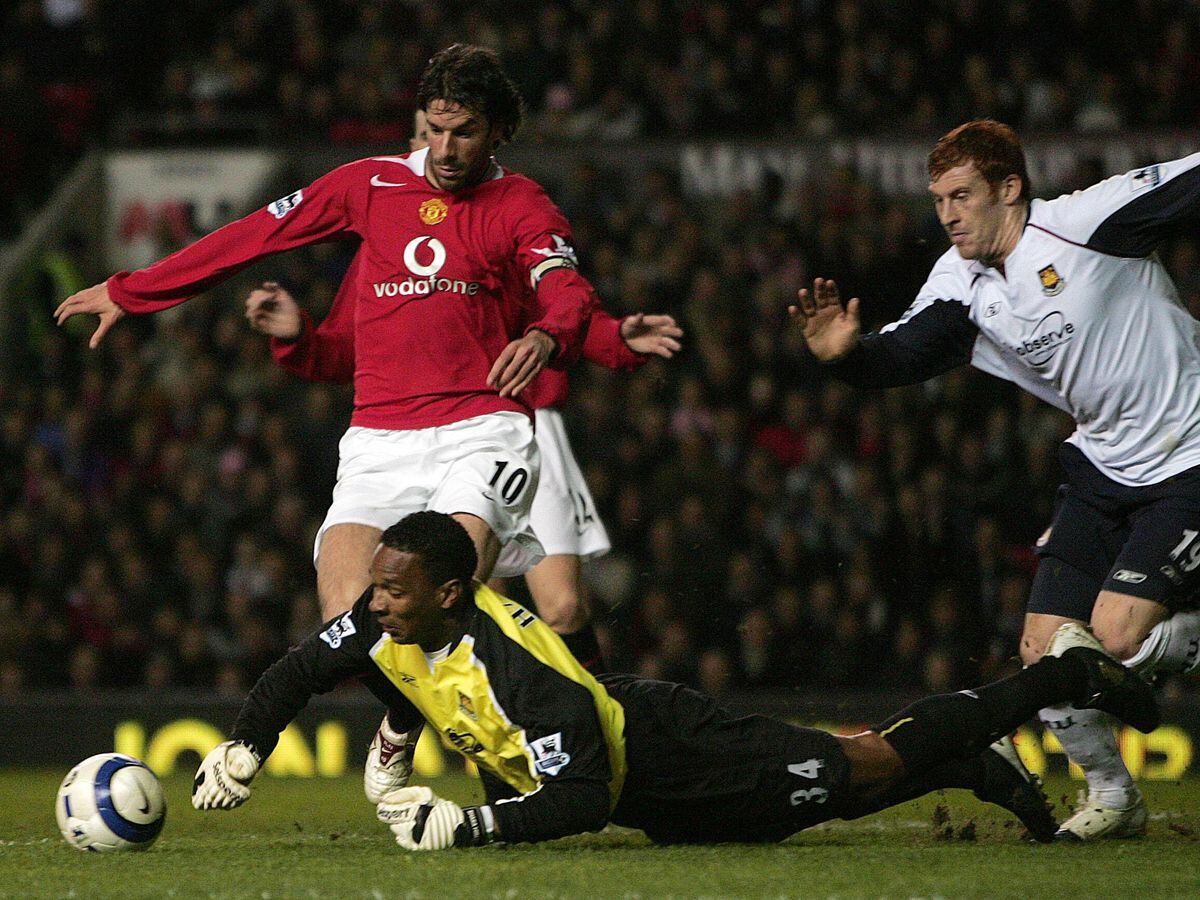Manchester United's Ruud van Nistelrooy  is stopped by West Ham United goalkeeper Shaka Hislop (bottom) as James Collins (R) looks on during the Barclays Premiership match at Old Trafford, Manchester, Wednesday March 29, 2006. PRESS ASSOCIATION Photo. Photo credit should read: Martin Rickett/PA.
 
 THIS PICTURE CAN ONLY BE USED WITHIN THE CONTEXT OF AN EDITORIAL FEATURE. NO WEBSITE/INTERNET USE UNLESS SITE IS REGISTERED WITH FOOTBALL ASSOCIATION PREMIER LEAGUE.