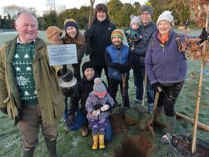Oak tree planting to commemorate the life of our recently deceased Queen Elizabeth II. Pictured front is Councillor Bernie Bentick with Meole village residents.