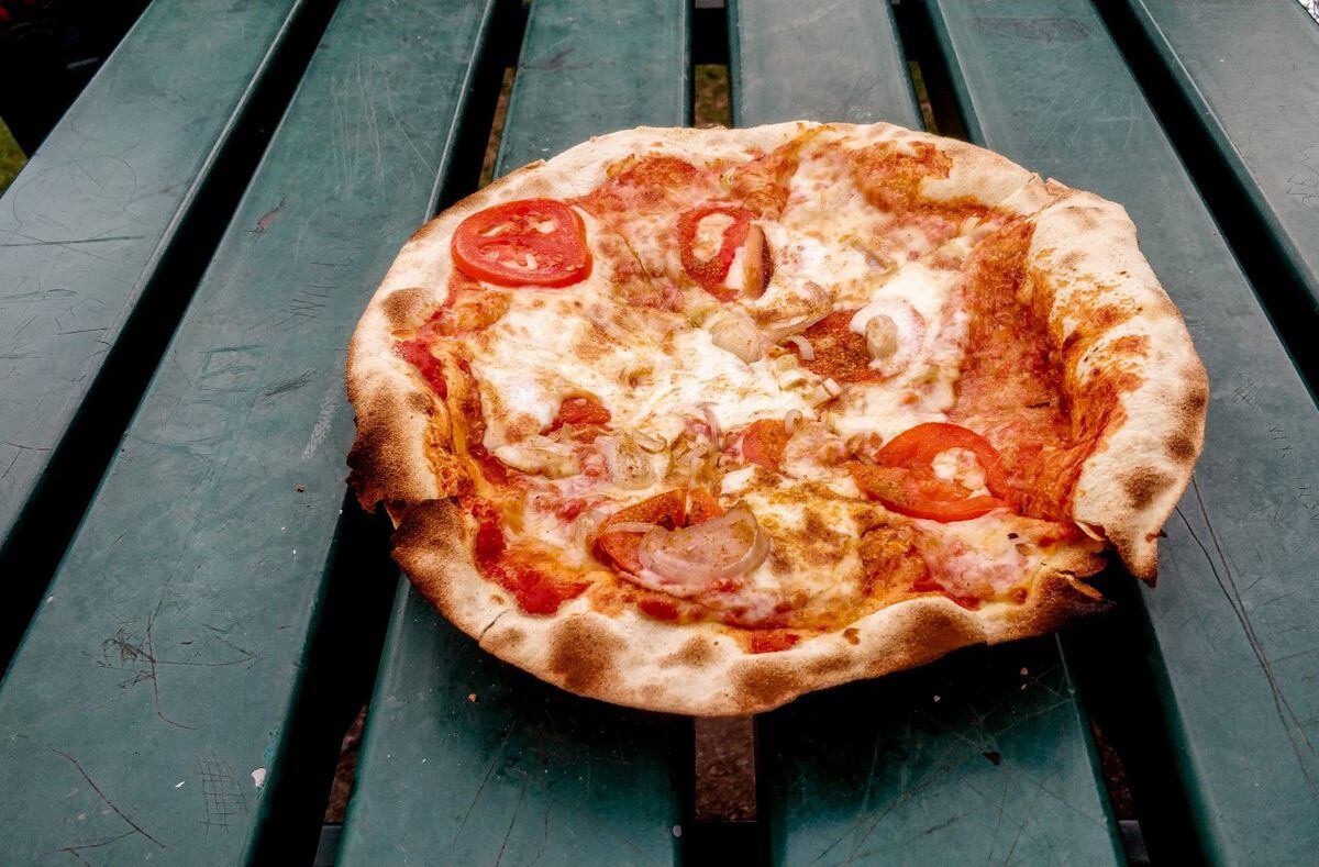 A smoked cheese and tomato pizza