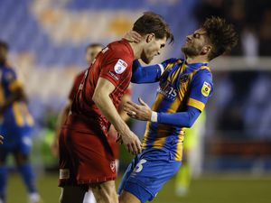 Tempers flare between Charlie Raglan of Cheltenham Town and Luke Leahy of Shrewsbury Town following a challenge of Jordan Shipley of Shrewsbury Town both players were sent off ..