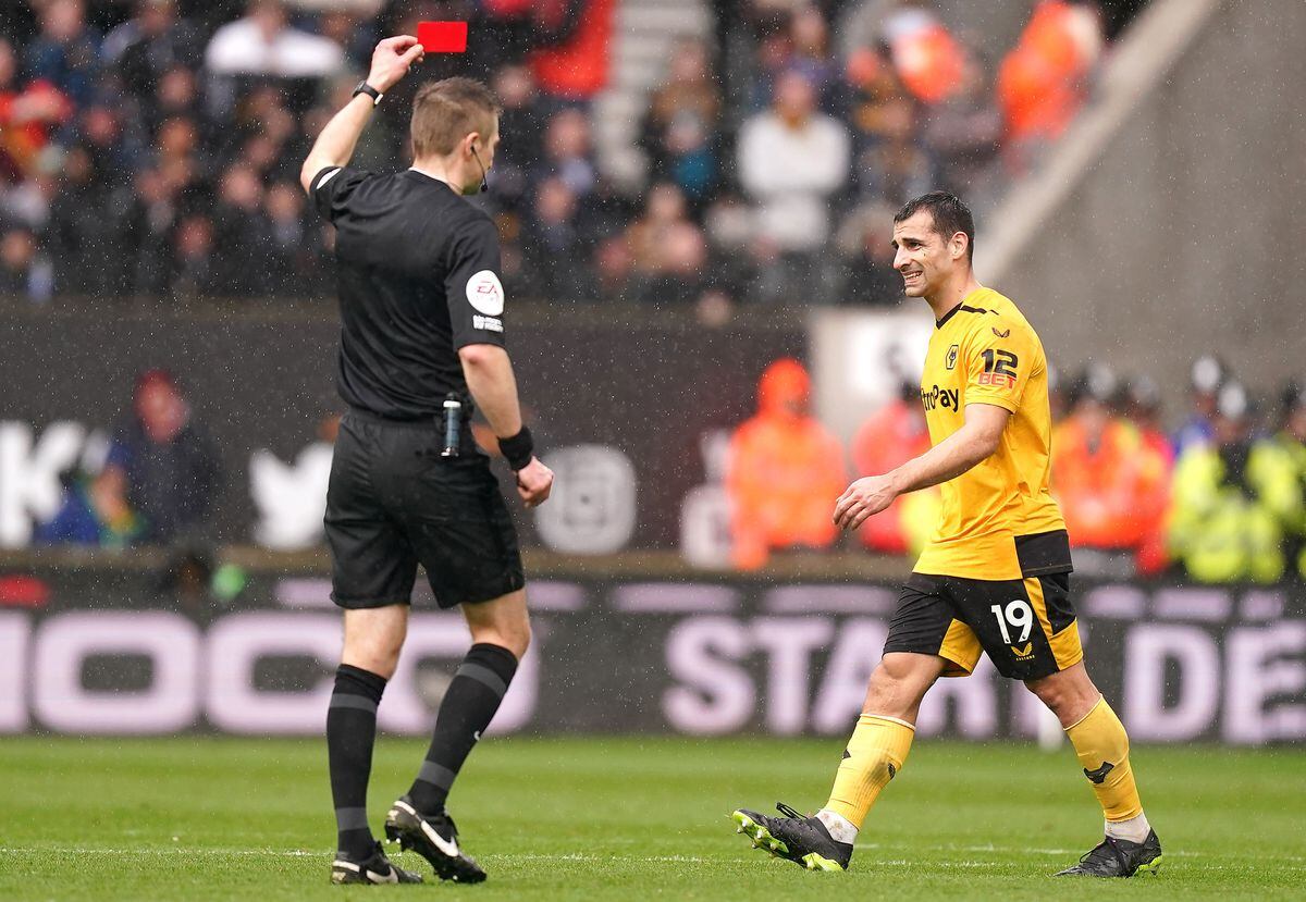 Jonny Castro Otto is shown a red card by referee Michael Salibsury. Picture: Mike Egerton/PA Wire.