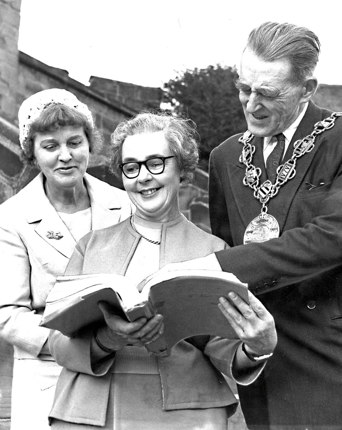 Edith, centre, at Shrewsbury Castle in 1961, with the manuscript of her latest book, The Heaven Tree, a 13th century historical novel in which the castle figured.