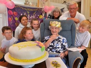 Barbara Bowdler celebrates turning 106 with a visit from Albrighton Primary School pupils Sam Peterson, Lily-Rae Johnson, Abigail Meayo and Kian Skippen, all 11. Her son and daughter, pictured, David Bowdler, 70, and Sue Scott ,74.