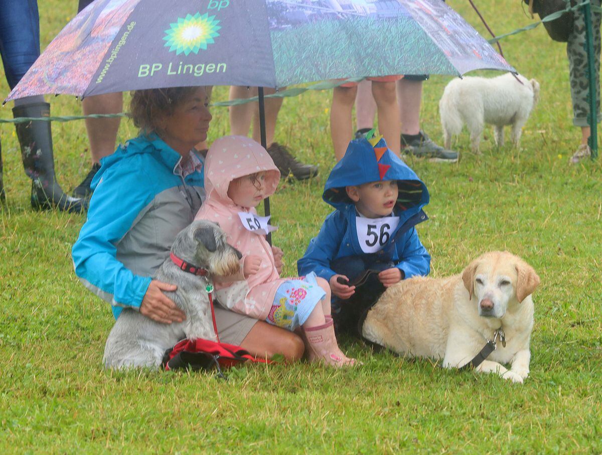Cuan Wildlife Rescue Centre open day. .Watching the dog show in the rain Rosemary Lewis with Henrietta Davies with her grand children from Arleston Wellington..