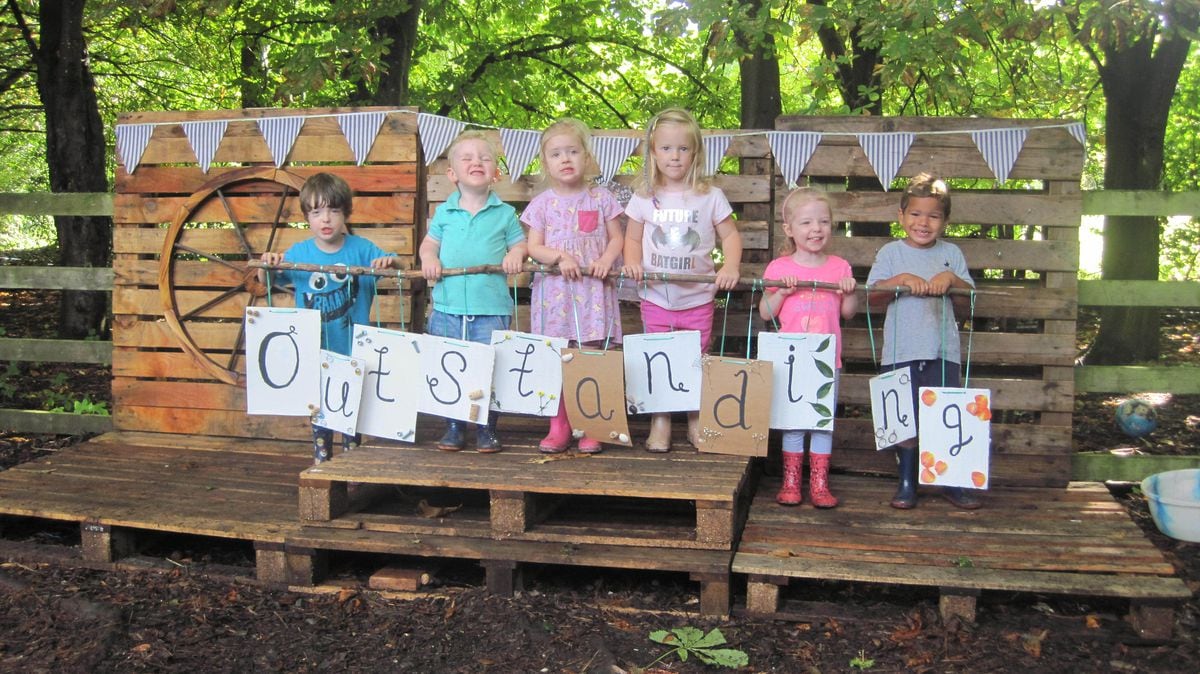 Children celebrate their outstanding Ofsted report