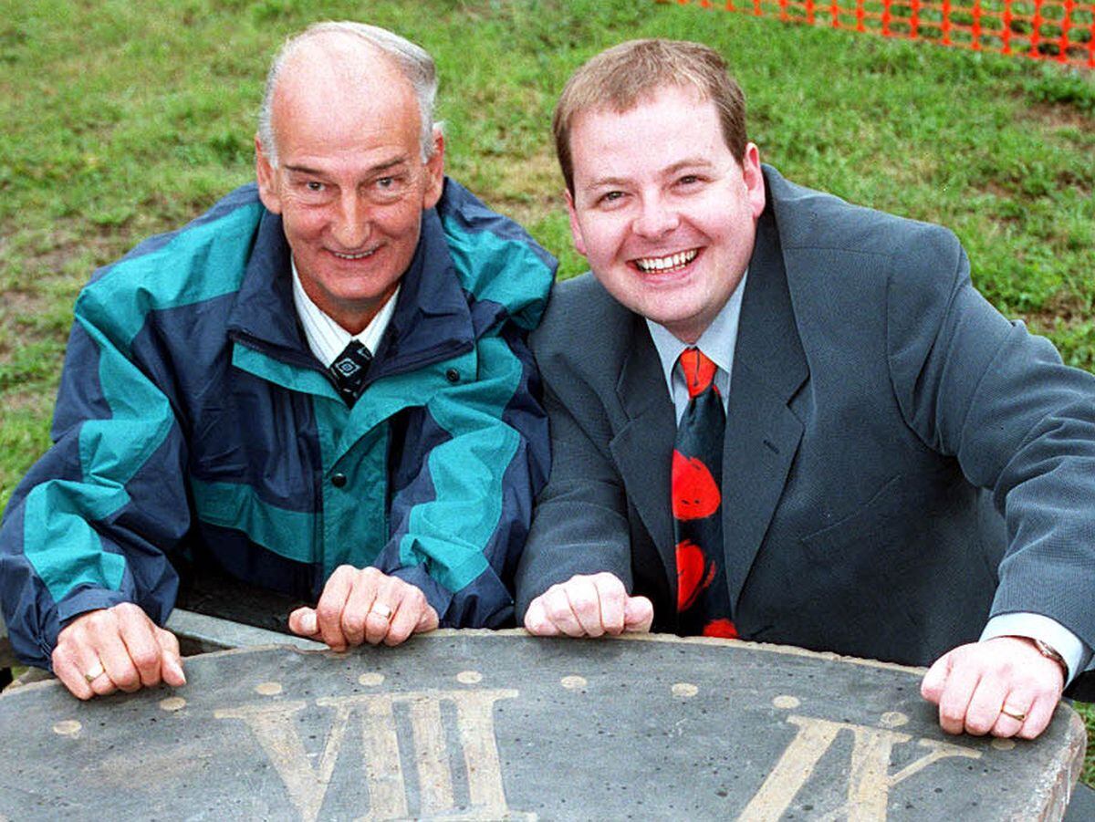 Roy Lane and television presenter Simon Keeling with the historic clock after its return to Broseley in September 1999.