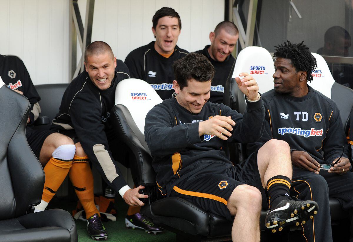 Michael Kightly of Wolverhampton Wanderers, turns back the seat of Steve Kemp Physio of Wolverhampton Wanderers.