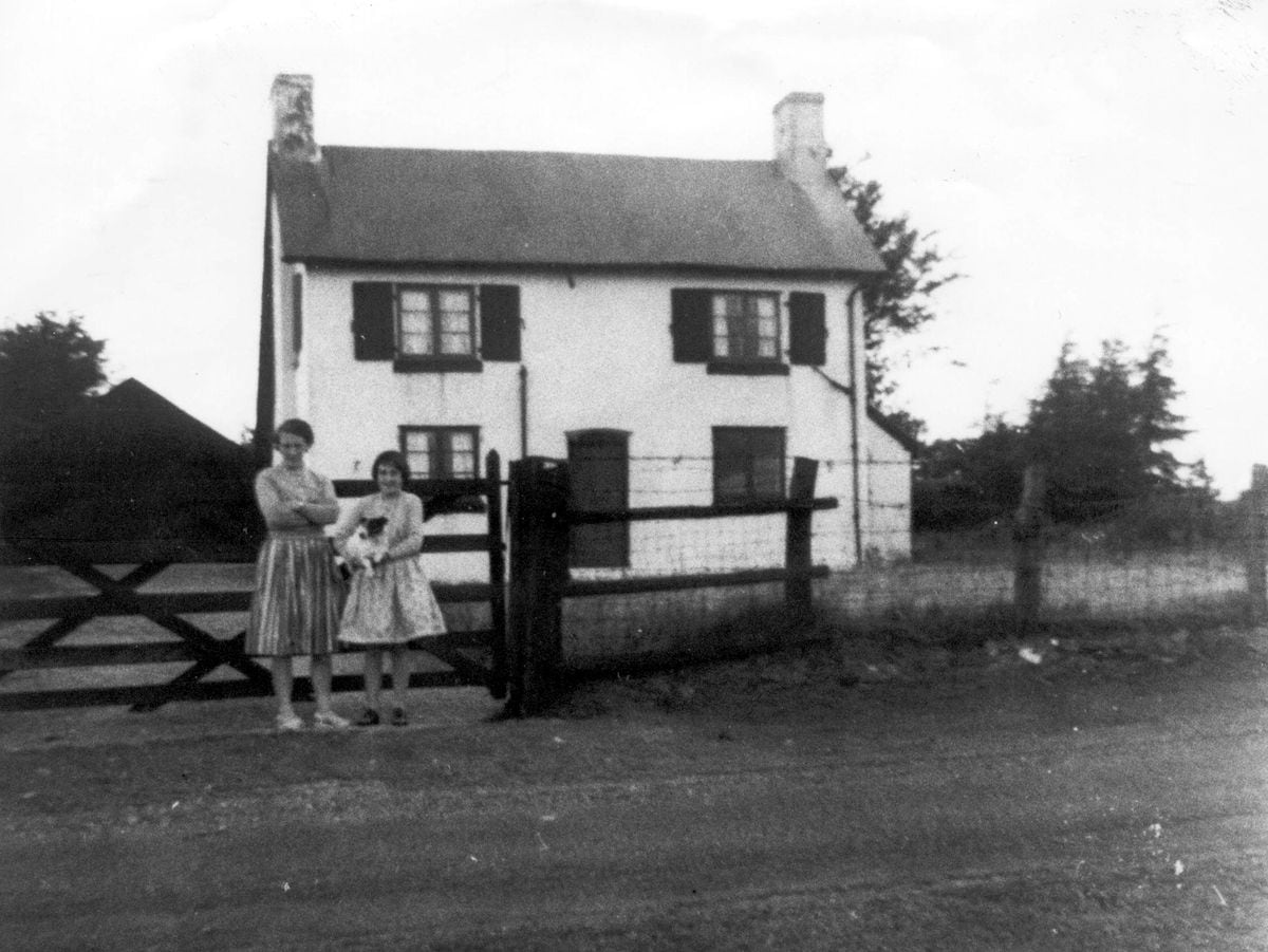 Pole Cottage and visitors in about 1960.