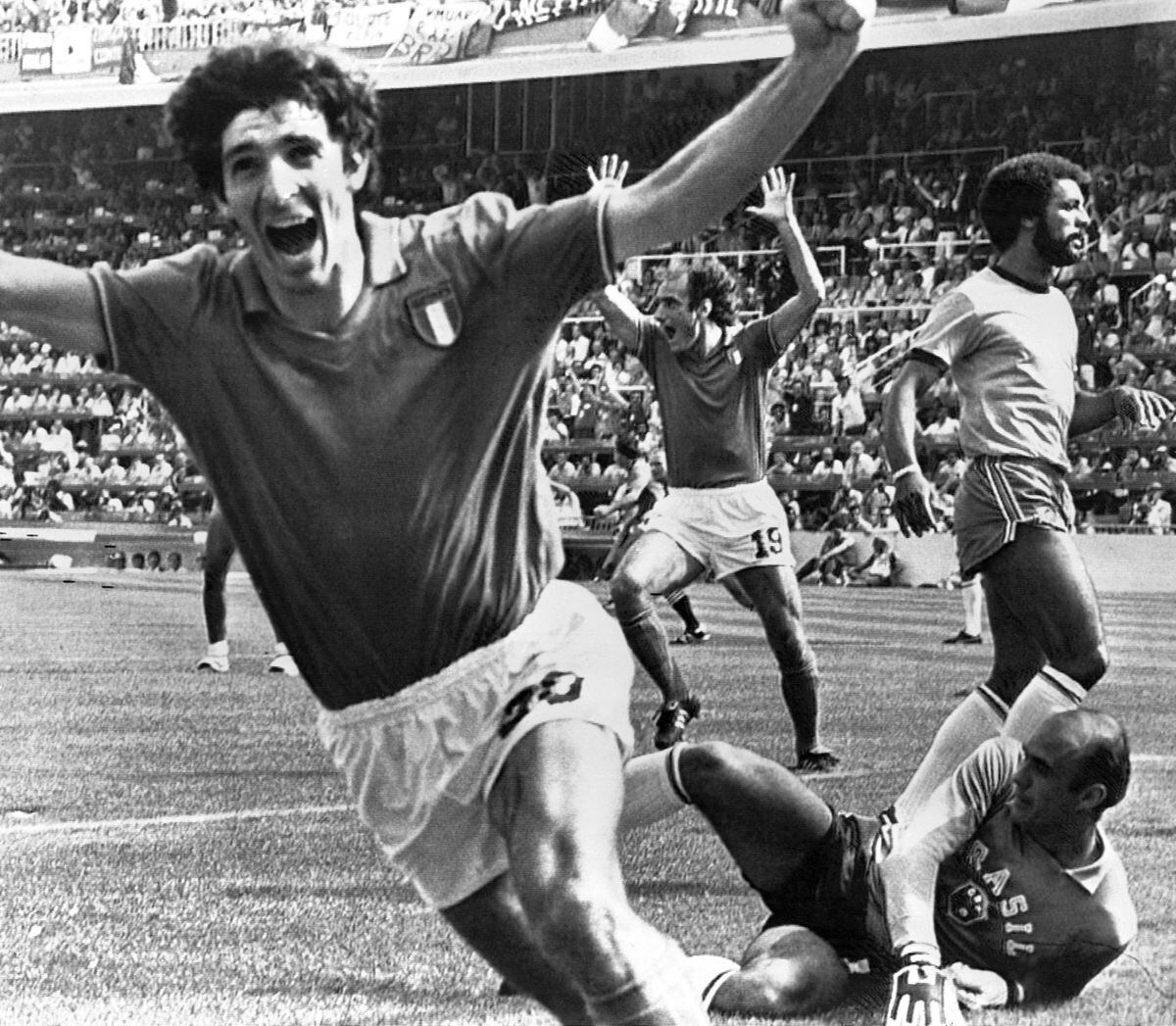 Italy's Paolo Rossi, left, celebrates, after scoring the second goal for his team during their second round match against Brazil, in Barcelona. (AP Photo).