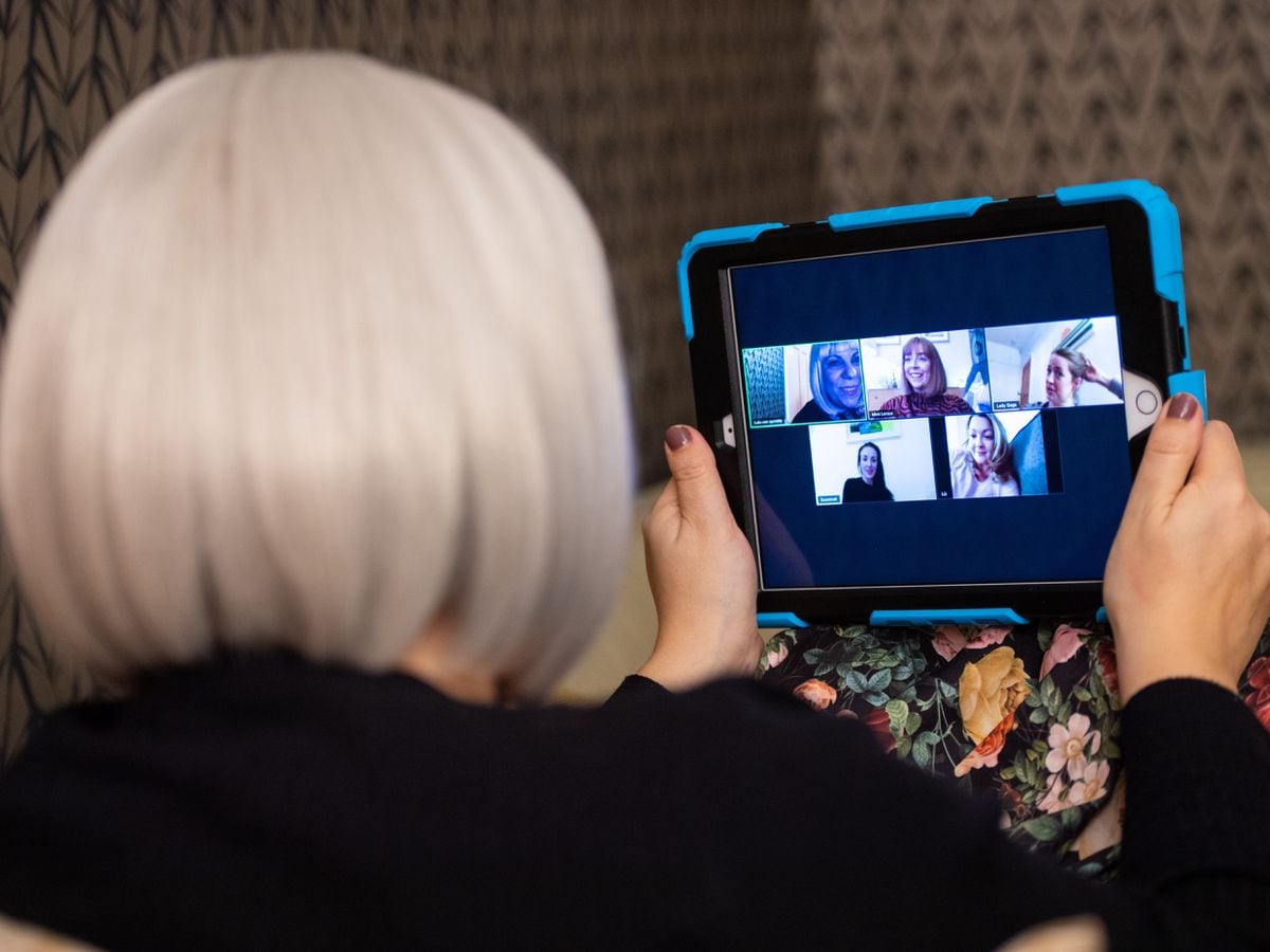 A group of women use the Zoom conferencing app