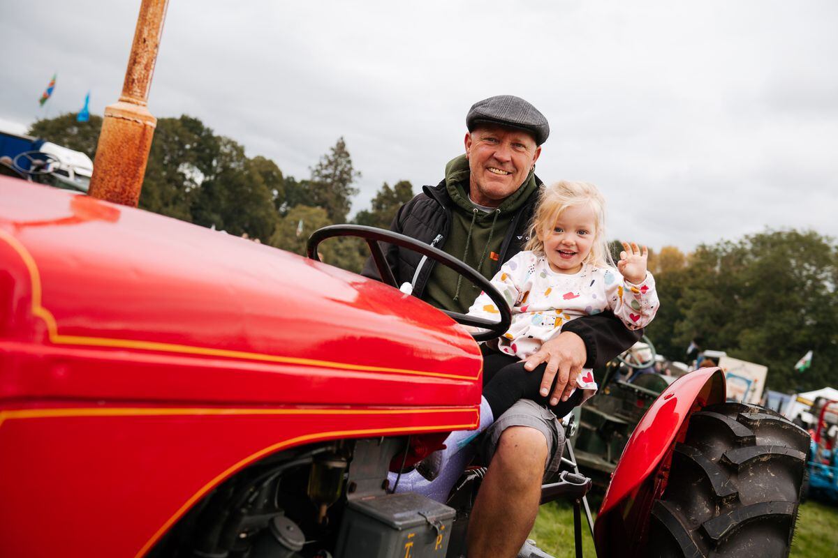 Paul Bowkett and Ella Shepherd 3 from Shrewsbury on her Grandad's Ferguson T20 Tractor..