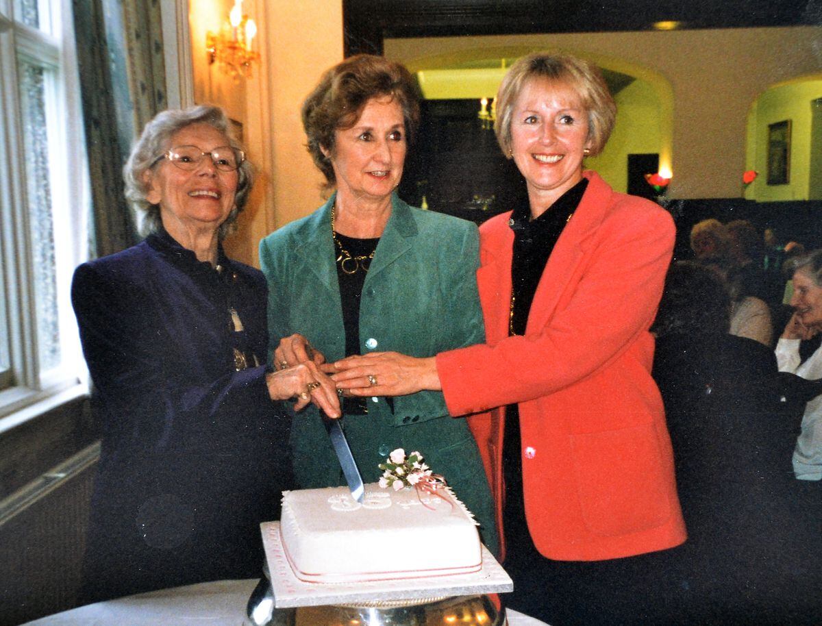 Cutting the cake for the coral anniversary in 1997, from left, Dorothy Ride, president; Pamela Beardsley, founder member; and Maureen Fullwood, chairman.
