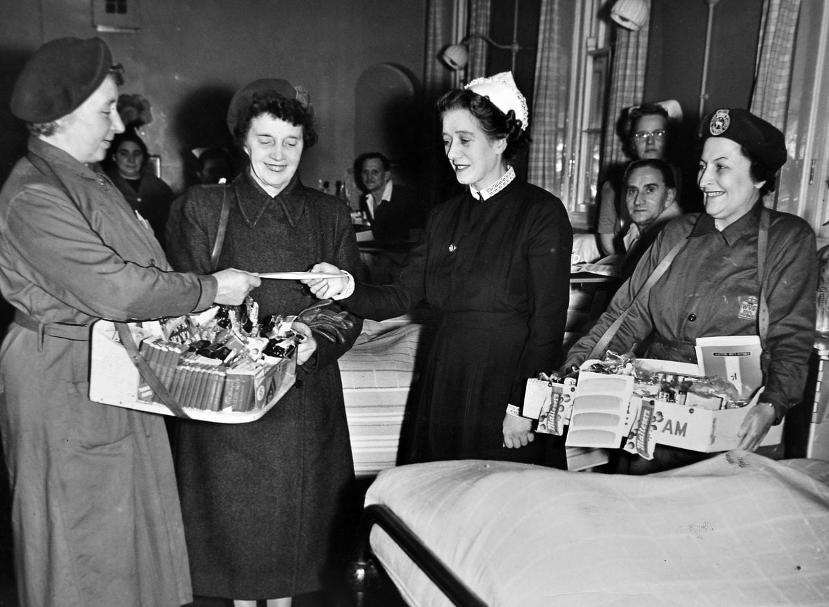 A £40 cheque, from money collected by the Women's Voluntary Service hospital trolley service, being presented at Wrekin Hospital, Wellington, in December 1957, for patients who would be spending Christmas there. The service leader, Mrs M Miles (left) presented the cheque to Matron Braithwaite.