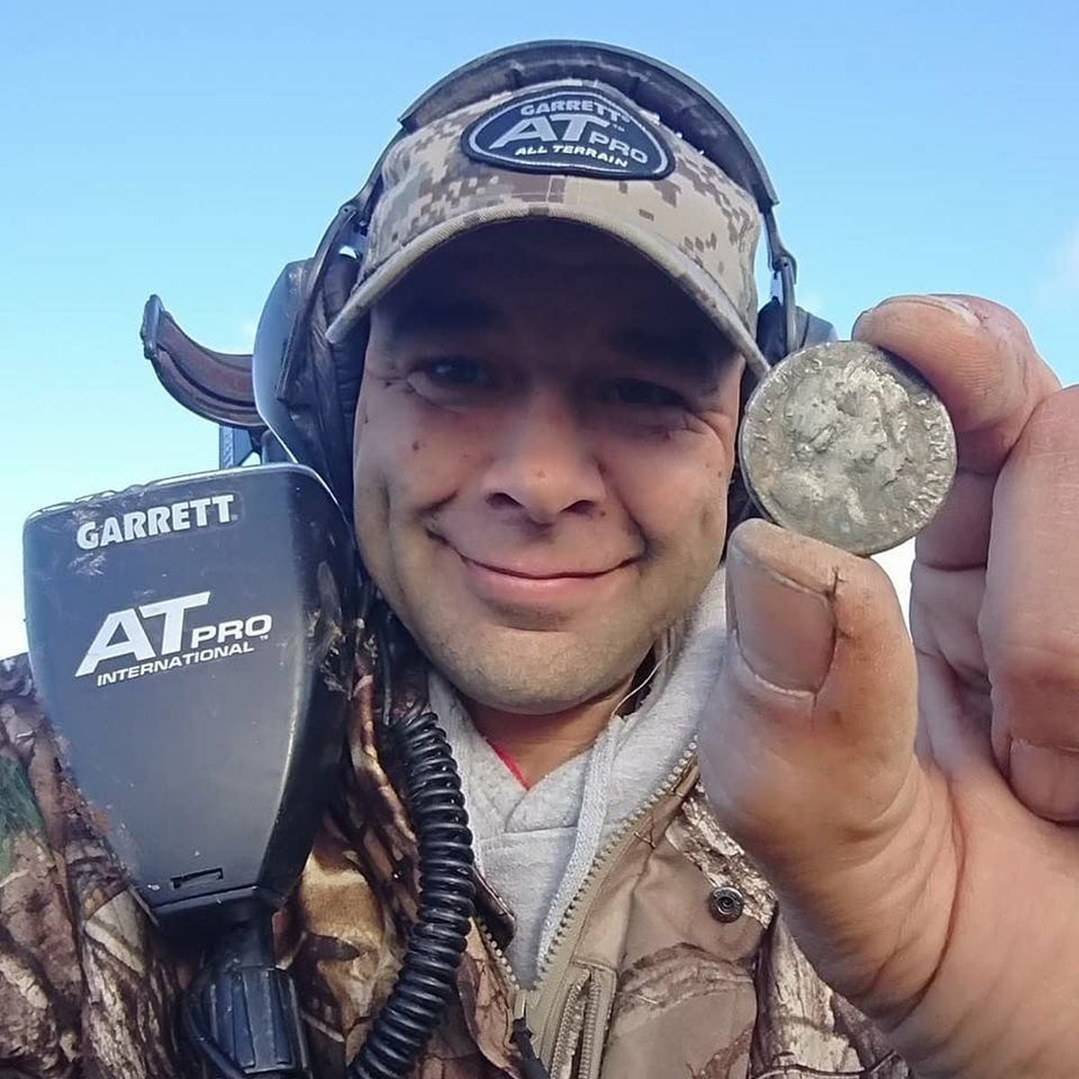 Chris Langston with a coin he found earlier this year