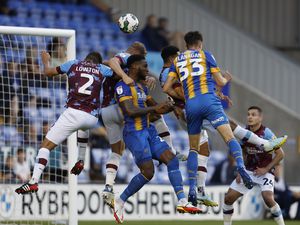 Chey Dunkley and Tom Flanagan of Shrewsbury Town compete for the ball at this Town corner.