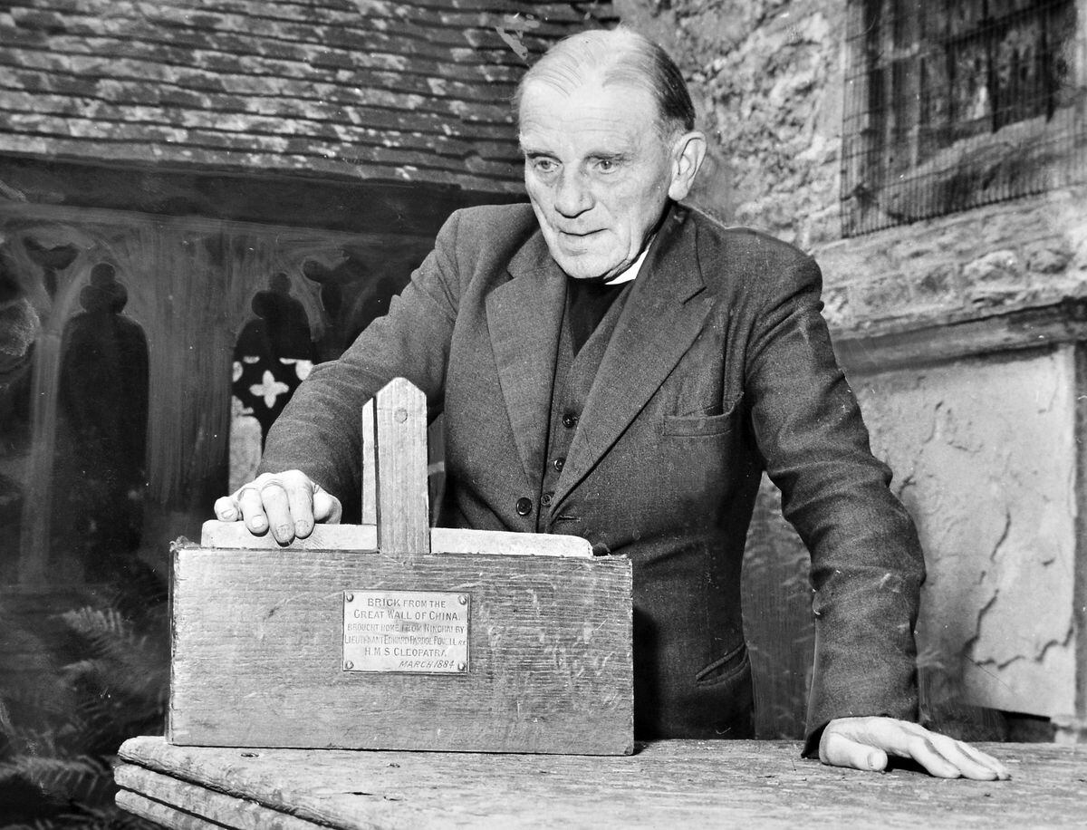 The Rev Edward Powell with the doorstop in 1961.