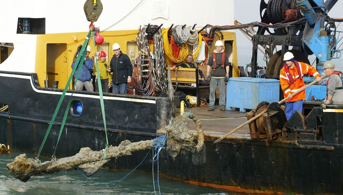 The anchor from King Henry VIII's flagship the Mary Rose, which foundered in the Solent off Portsmouth in 1545, is lifted out of the sea on Tuesday October 11 2005