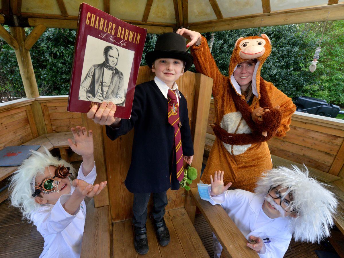 Enjoying Darwin Day at St Georges Junior School is Mini Darwin on the chair Flynn Parry, 7, and with him is Monkey: Kelly Lee and two little Einsteins: Ashton Morris 10 and Olivia Caffrey 11.(COPYRIGHT SHROPSHIRE STAR)