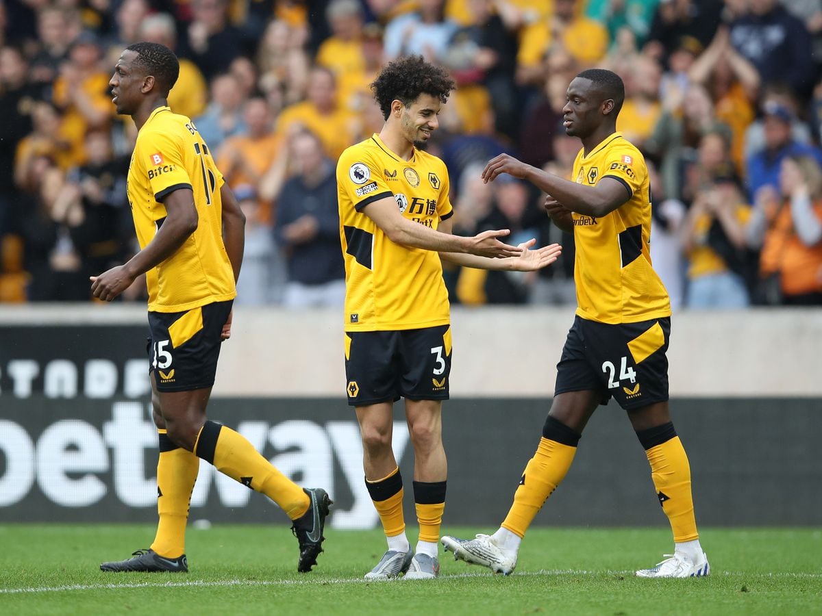 Rayan Ait-Nouri celebrates with Toti Gomes after scoring against Norwich City