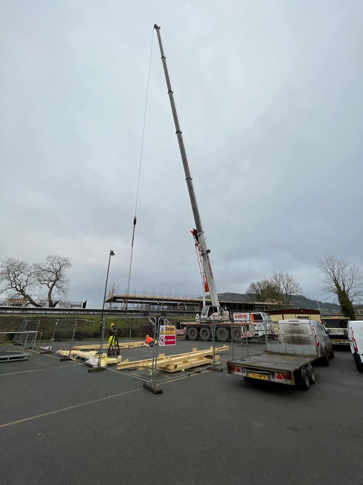 The crane lifting on the new canopy. Photo Richard Walliliker.
