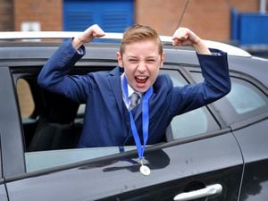Year six pupil Fraser Brewer enjoys the drive-through prom held at his school, Priorslee Primary Academy, to mark the end of term