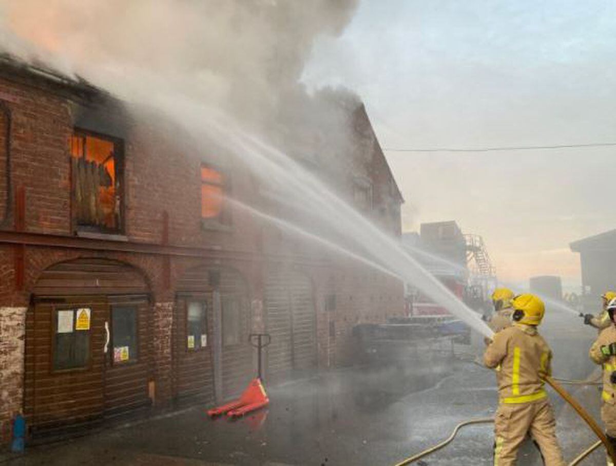 Dramatic pictures show smoke billowing through the roof at CJ Wildlife. Pictures: Shropshire Fire and Rescue Service